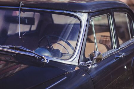 retro car, steering wheel and mirror of a vintage automobileの写真素材