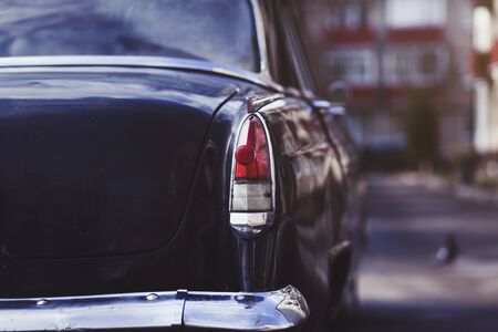 Tail fin and taillight details of a classic car.の写真素材