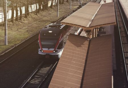 railway station with modern high speed commuter trainの写真素材
