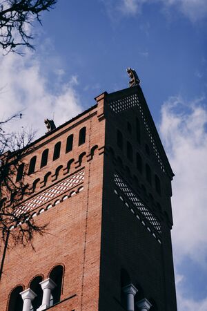 Red Catholic Church against the blue sky in Minskの写真素材