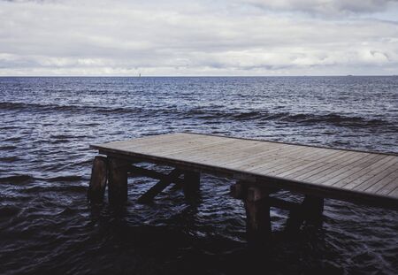 Wood bridge or pier on the beach and seaの写真素材