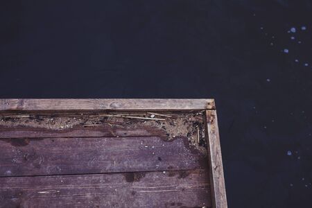 wooden pier by the water, top viewの写真素材