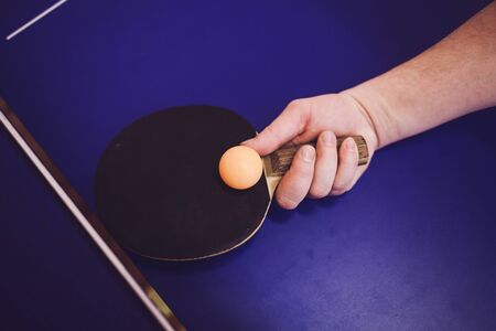 hand with rocket hits the ball.の写真素材