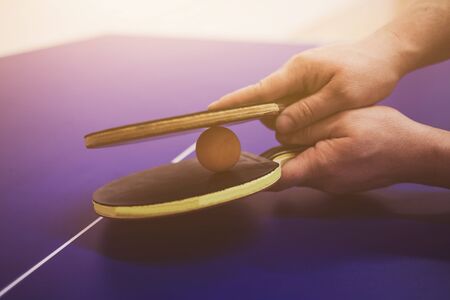 close- up of tennis rackets  in the handsの写真素材