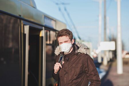 COVID-19 pandemic coronavirus a person in a public place wearing a protective mask to spread the 2019 coronavirus diseaseの写真素材