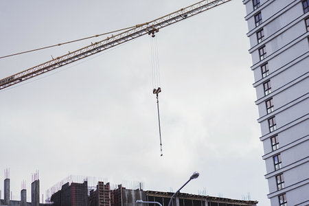 Construction site with crane on sky background. mortgageのeditorial素材