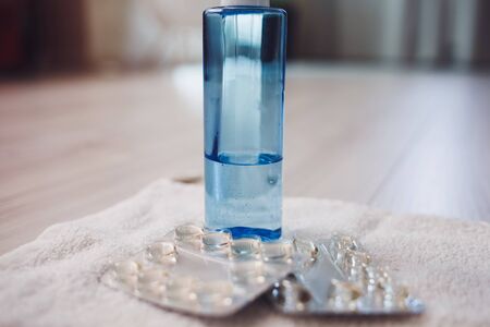 medical pills and liquid soap on towel. Concept quarantine and protective against coronavirusの写真素材
