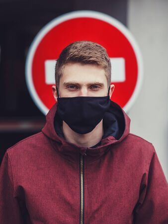man in black mask in city, coronavirus, illness, infection, quarantineの写真素材