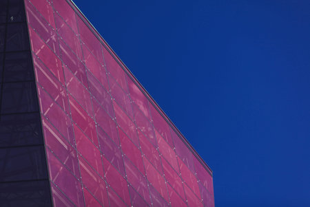 modern urban architecture. red office glass building against the sky