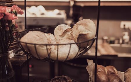 fresh baked goods in the window of a bakery or storeの写真素材