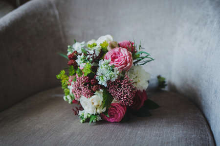 fresh wedding bouquet on the chair. wedding preparationsの写真素材