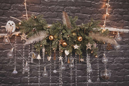 composition of light bulbs and balls on a Christmas decoration hanging on the wallの写真素材