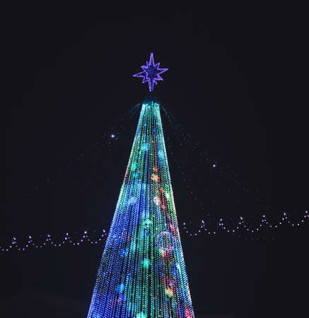 Street decorated with Christmas lights. Christmas mood in the city.の写真素材