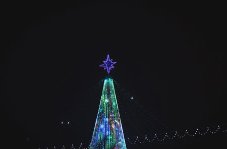 Street decorated with Christmas lights. Christmas mood in the city.