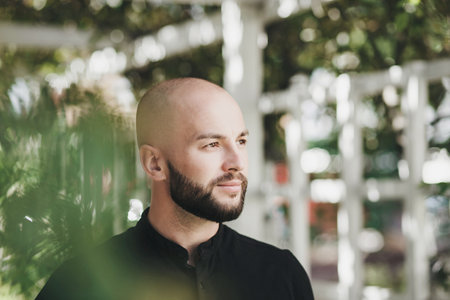 Urban portrait handsome man wearing watch and t-shirtの写真素材