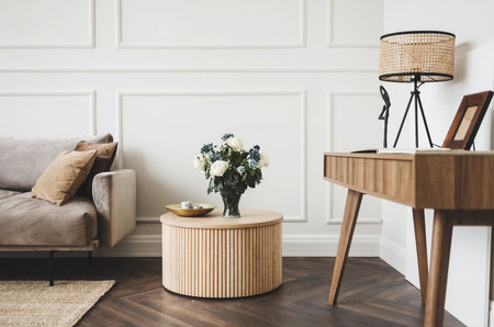 spacious living room with a classic table and chairs in a Scandinavian interiorの写真素材
