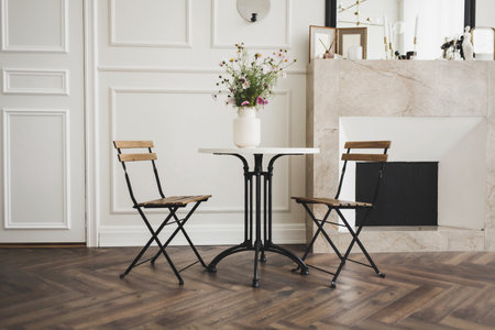 spacious living room with a classic table and chairs in a Scandinavian interiorの写真素材
