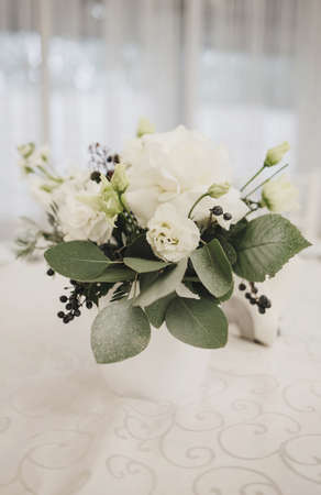 fresh bouquet of flowers on the wedding table. the decor of the restaurantの写真素材