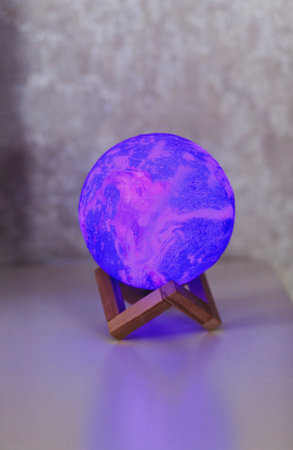 glowing moon lamp on the table. neon night light