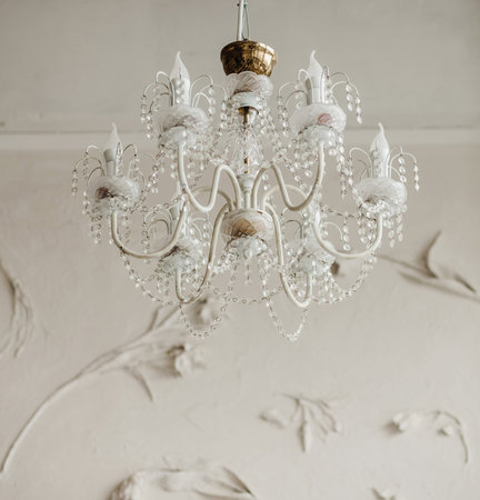 majestic vintage chandelier hangs from the ceiling in an old interior