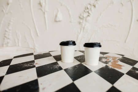 Takeaway paper coffee cup on table cafeの写真素材