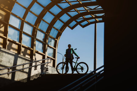Sport woman riding on bicycle on sunset forestの写真素材