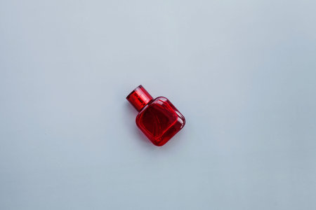 Passion red bottle of perfume on backgroundの写真素材