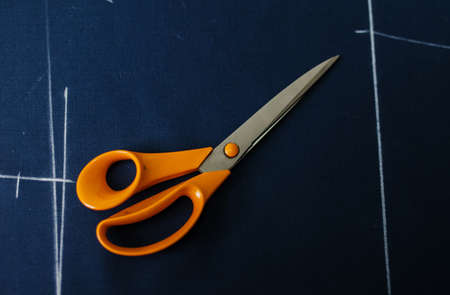 close-up of the tailor's hands at work in the atelierの写真素材