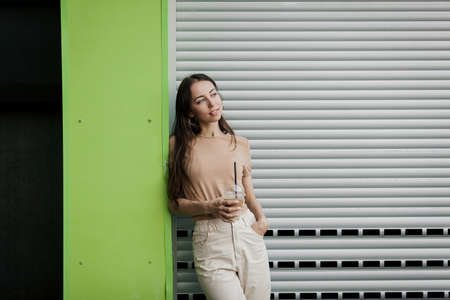 Happy smiling woman wearing casual clothes in streetの写真素材