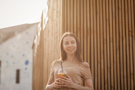 summer portrait of a stylish young girl with a refreshing drink