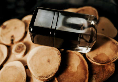 black fragrance perfume bottle on wood background. Top view.の写真素材