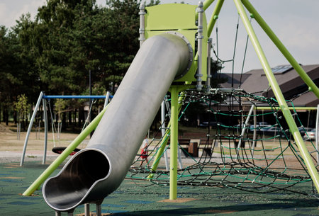 Open sun lawn for kids. Safe and cozy children 's playground with a variety of attractions. Bright...