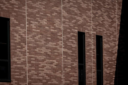 Modern bricks building with sky backgroundの写真素材