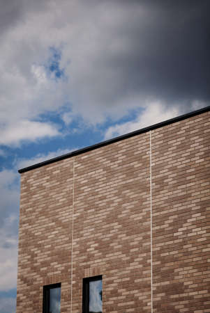 Modern bricks building with sky backgroundの写真素材