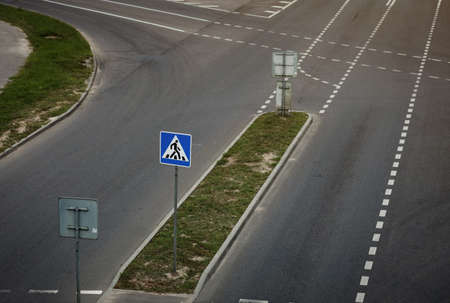 A pedestrian crossing sign over an empty road. Top view. Traffic safetyの写真素材