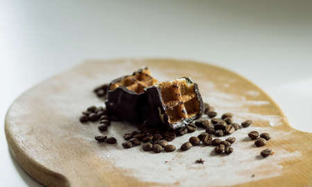 Cake decorated coffee beans. Sweet food. Wooden background.の写真素材