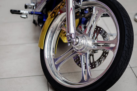 chrome wheel and spokes of the motorcycle. forks and tires.