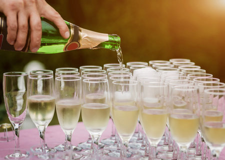 Circle wedding arch decorated with white flowers and greenery outdoors. Wedding setting. Floral compositionの写真素材
