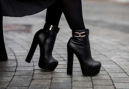 Traditional miniature christmas - happy people near christmas treeの写真素材