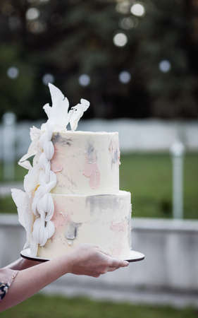 Traditional miniature christmas - happy people near christmas treeの写真素材