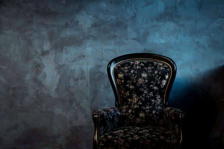 stylish chair made of wood in dark loft interior. copy spaceの写真素材