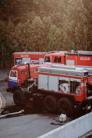 Minsk, Belarus, November 2021 - Fire truck with firehose in parkのeditorial素材