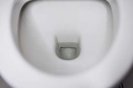 porcelain toilet bowl with water.の写真素材