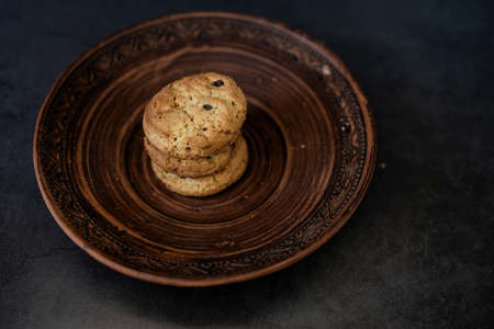 fragrant black pepper grain in a white bowl. seasoning for cooking meat and other food productsの写真素材