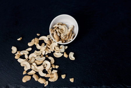 fragrant black pepper grain in a white bowl. seasoning for cooking meat and other food productsの写真素材