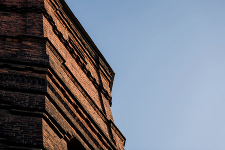 brick building construction. old brick industrial building against the sky