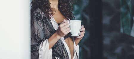 beautiful woman with cup. Dream and relaxの写真素材