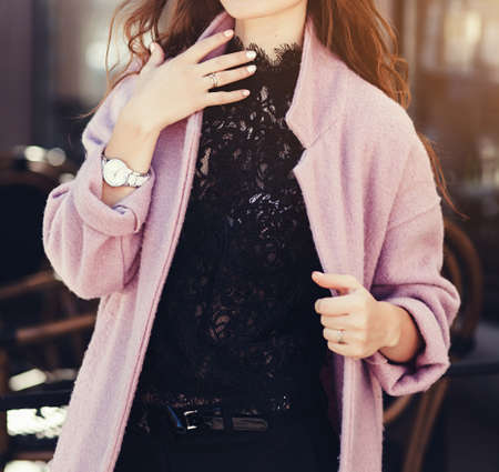 portrait of a stylish woman wearing stylish coat in an urban environmentの写真素材