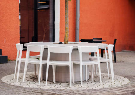 street cafe. empty chairs around the table of a street restaurantの写真素材