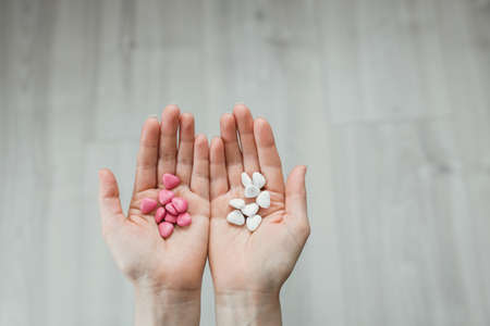 Stylish guy standing street in a denim jacket against metal wallの写真素材
